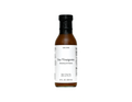 Bottle of soy vinaigrette dressing on a white background